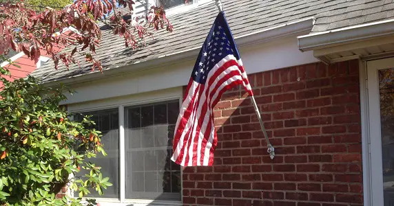 American Flag In Front Of House Meaning
